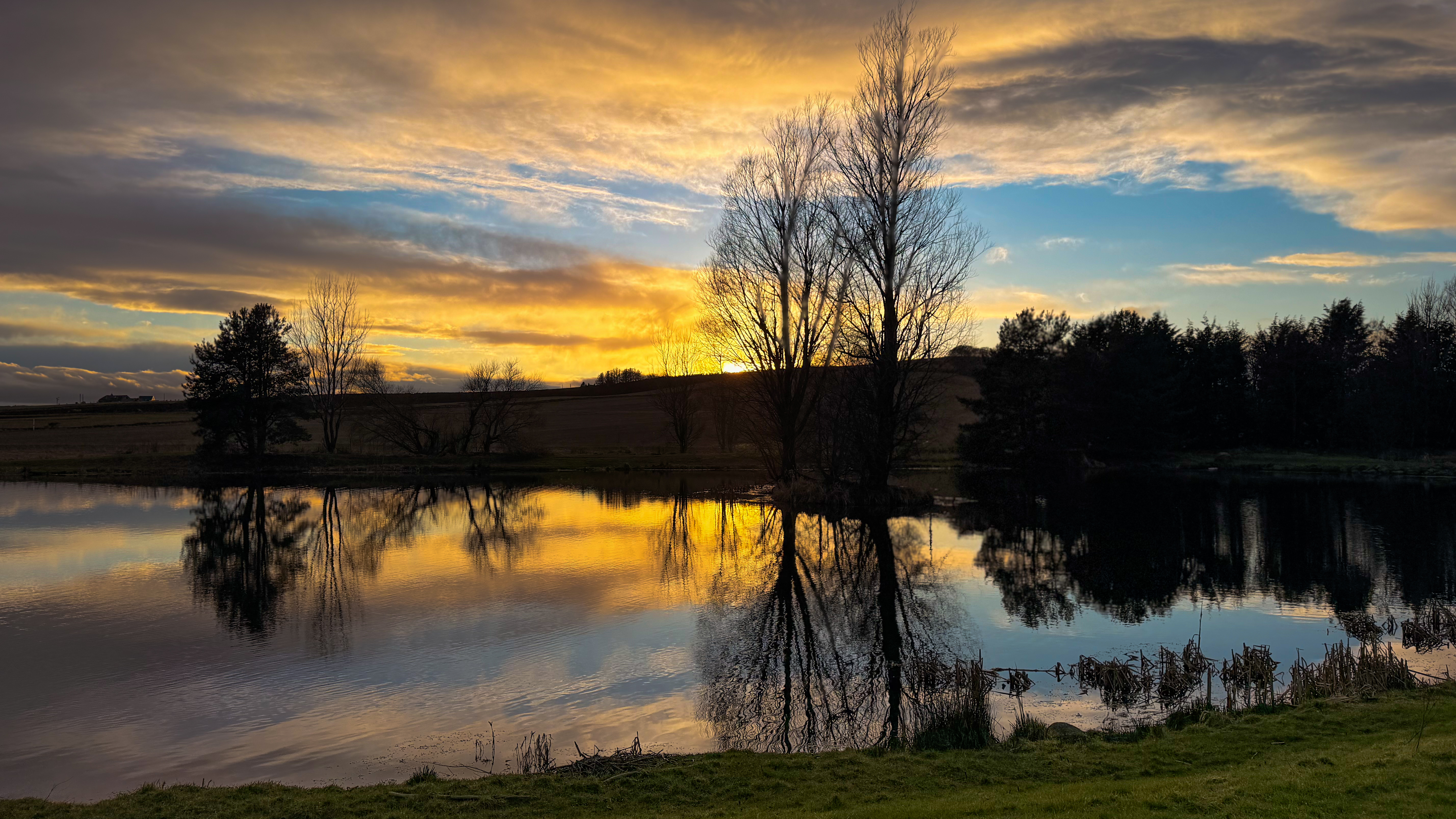Sunset over the loch at Loch Insch Fishery, Aberdeenshire